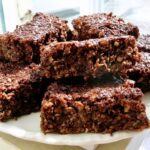 Homemade chocolate coconut flapjacks on plate.