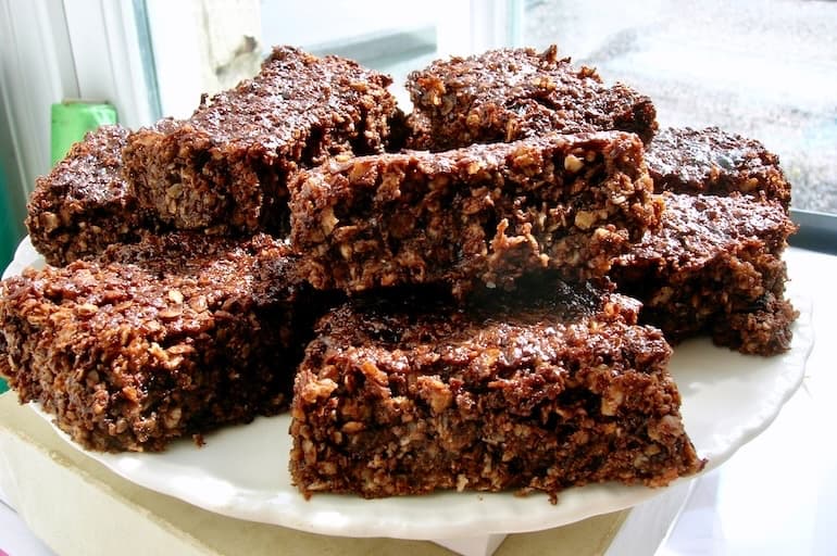 Homemade chocolate coconut flapjacks on plate.