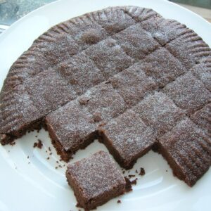 A plate of Chocolate and Cinnamon Shortbread cut into squares.