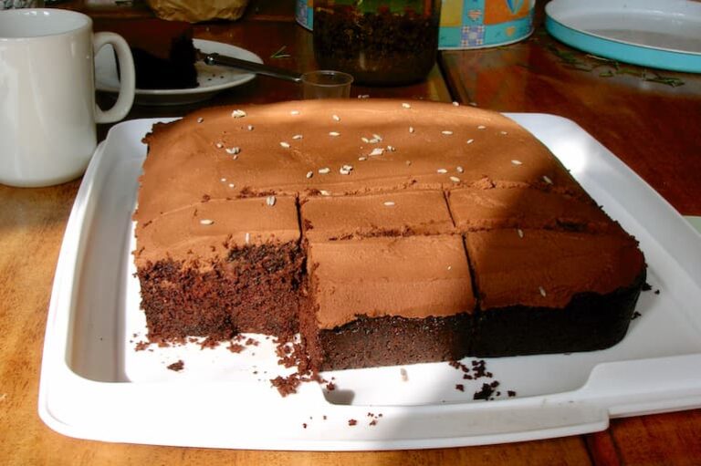 Chocolate lavender cake traybake with one slice removed.