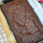 Chocolate prune gingerbread loaf cake in tin.