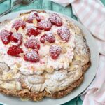 Large marbled chocolate meringue with raspberries and cream.
