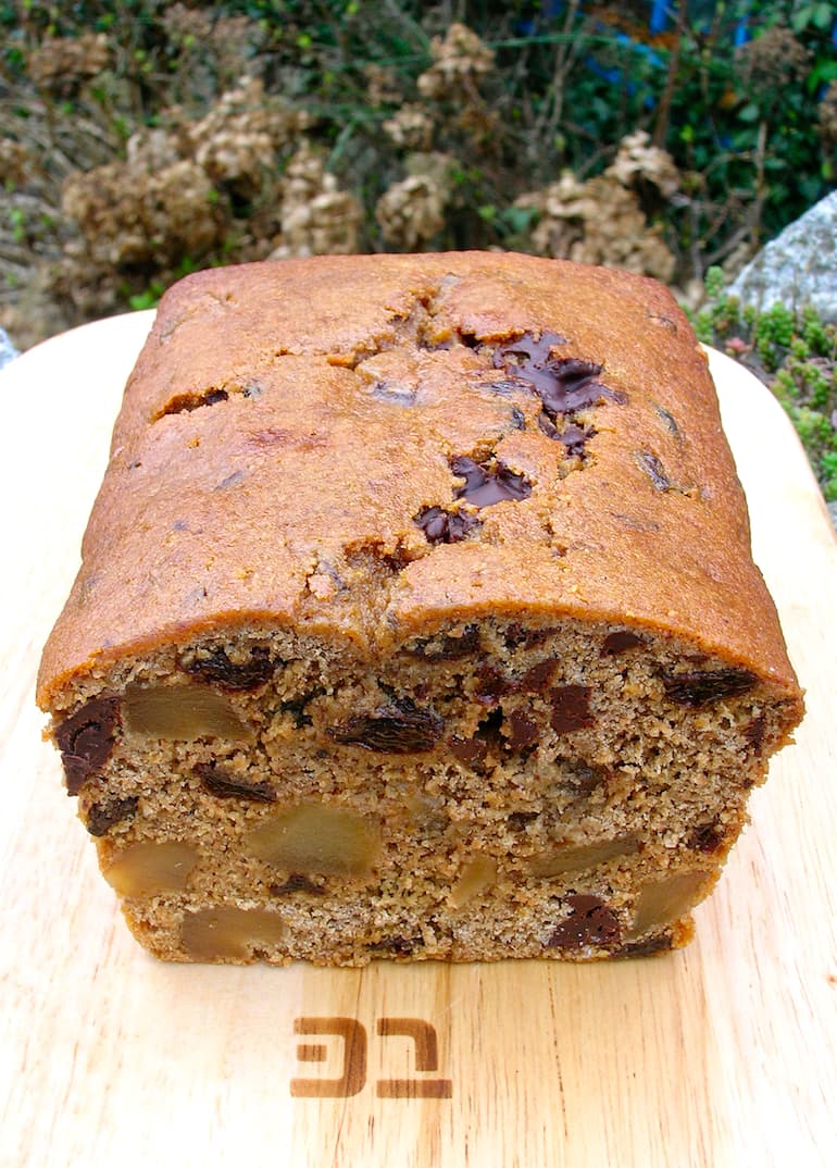 A sliced into loaf of chocolate ginger tea bread.