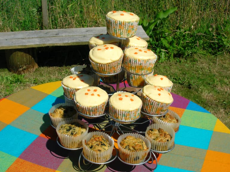 Apricot curd and white chocolate cupcakes in wire cupcake stand.