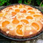 Homemade apricot frangipane tart in tin.