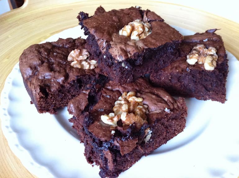 A pile of black bean brownies on a plate.