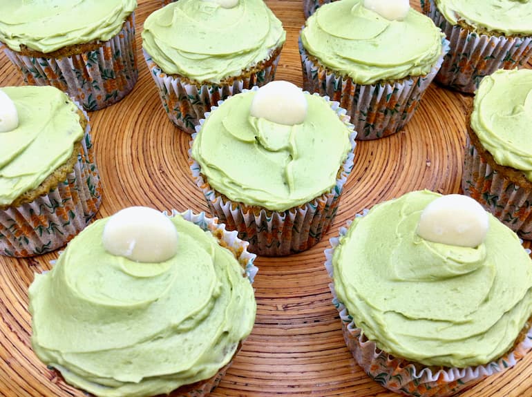 Close up of matcha cupcakes with white chocolate buttons.