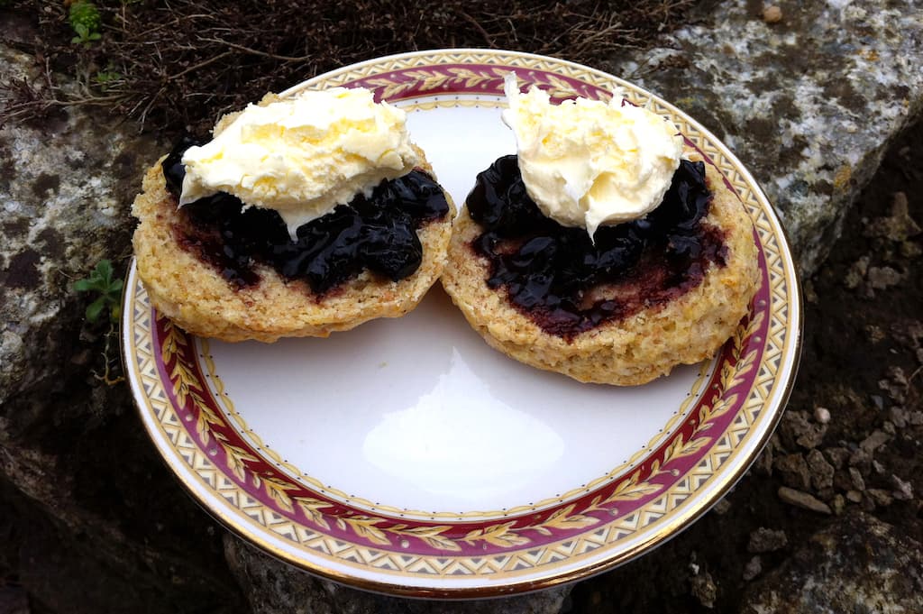 White chocolate scones with blackcurrant jam and clotted cream.