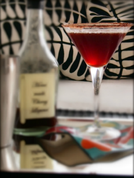 A glass or black forest Manhattan cocktail.