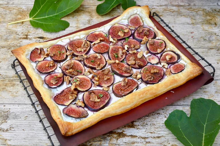 Fig, walnut, honey and thyme goat's cheese puff pastry tart cooling on a wire rack.