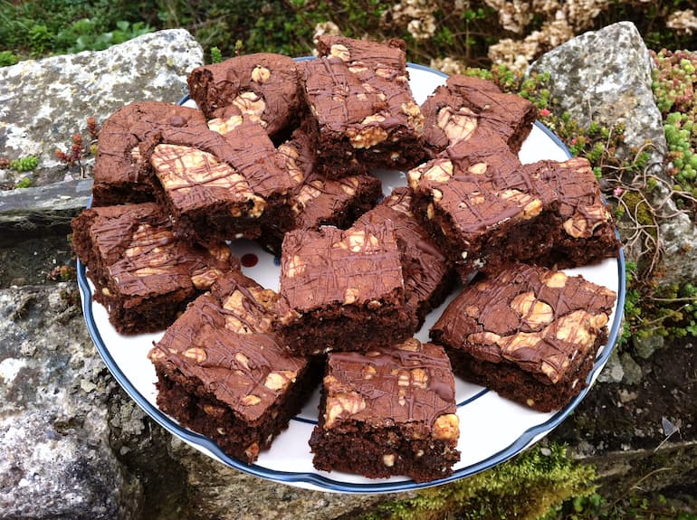 Plate piled with swirled peanut butter brownies.