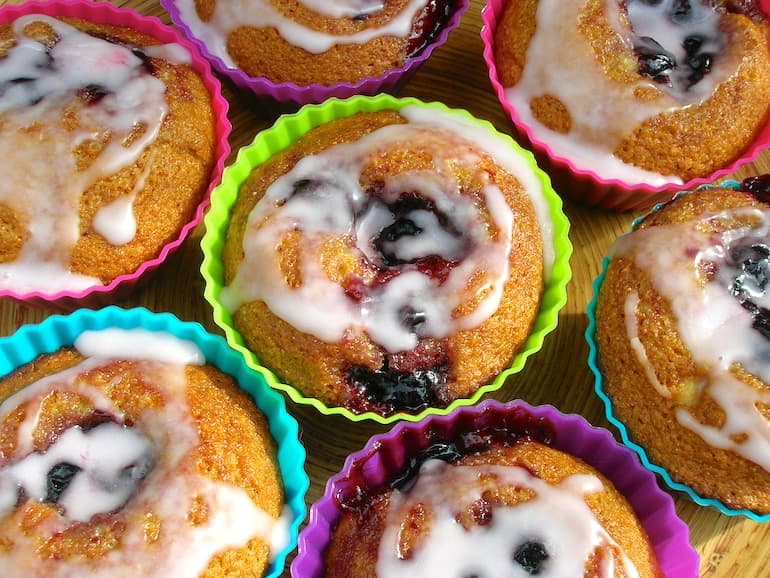 Blackcurrant rose honey cakes (aka Nonnettes) in colourful silicone cases.