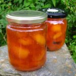 Two jars of homemade vanilla apricot jam.