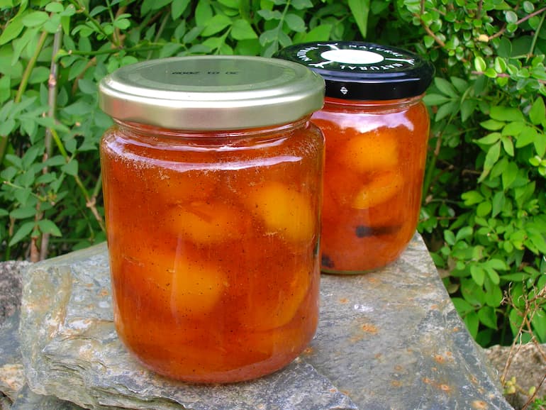 Two jars of homemade vanilla apricot jam.