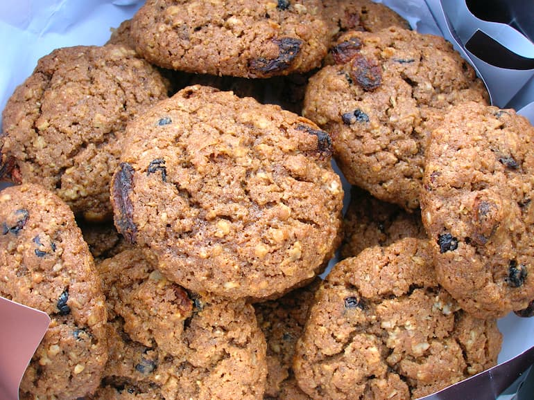 Close up of a tin of homemade spelt, rye & berry cookies.
