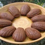 Bamboo platter of ten homemade spicy chocolate madeleines.