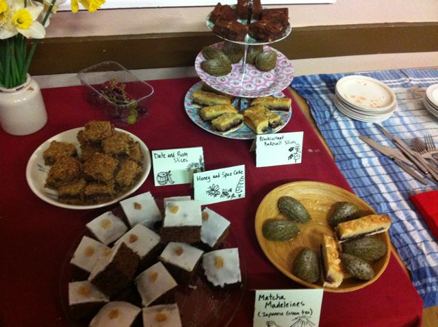 A spread of party cakes, including matcha madeleines.