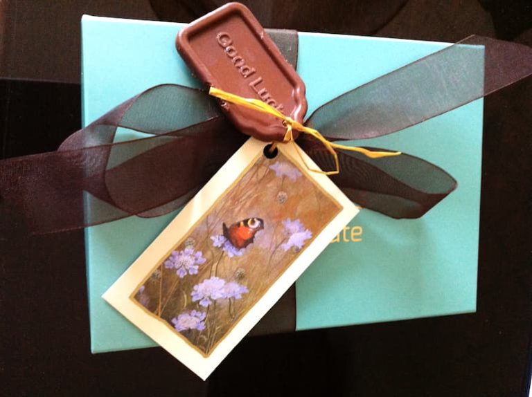 A box of homemade salted milk chocolate with chocolate label.