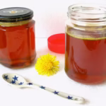 Two jars of homemade dandelion honey.