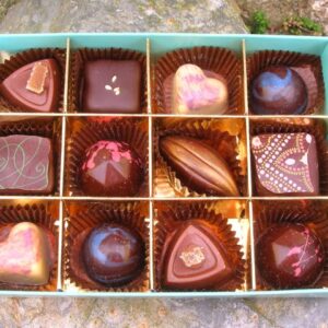 An open box of chocolates from artisan chocolatier, Kokopelli's Chocolate.