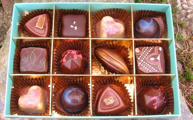 An open box of chocolates from artisan chocolatier, Kokopelli's Chocolate.