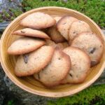 A plate of homemade chocolate drops (chocolate chip cookies).