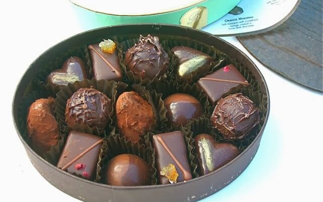 An open box of dark chocolates from Bettys.