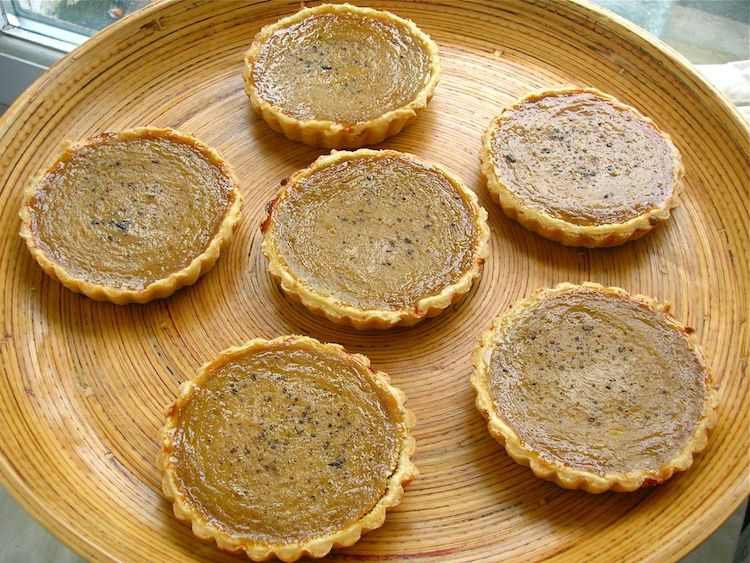 Platter of homemade chilli and ginger persimmon tarts.
