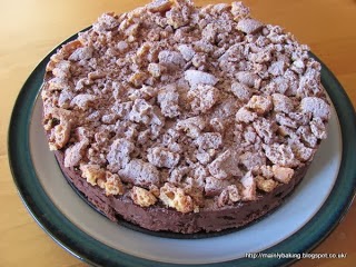 A homemade Amaretto truffle cake on a plate.