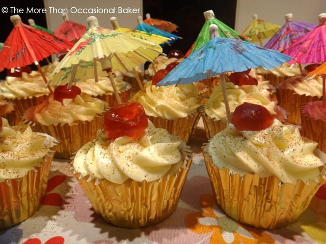 Painkiller cupcakes complete with cherries and paper umbrellas.