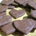 Plate of textured chocolate biscuits.
