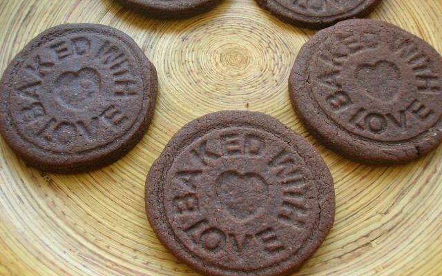 Chocolate Biscuits stamped with the message "Baked with Love".