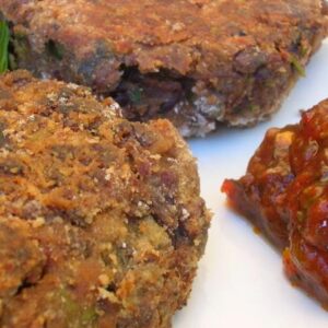 Chocolate Bean Burgers served with hot chilli sauce.