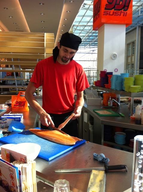 Mazz filleting salmon at Yo Sushi. Also the man on top tips for rolling sushi.
