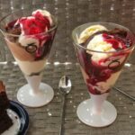 Chocolate Blackcurrant Sundae Royale in two glasses.