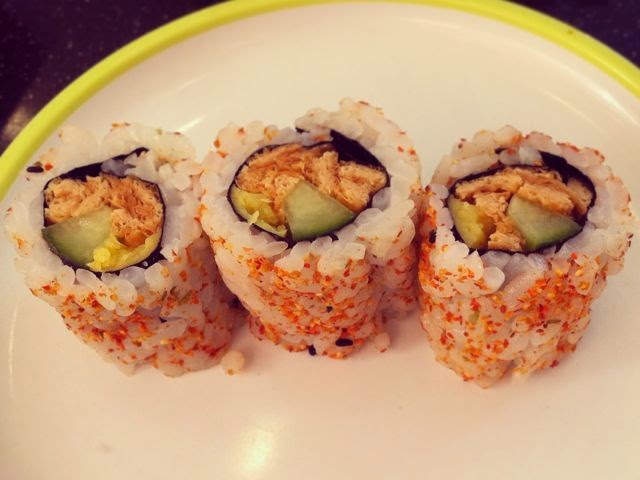 Three tofu uramaki sushi rolls.