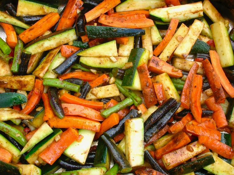 Spiced roasted summer vegetables ready to go into the oven.