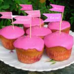 Shocking pink beetroot and orange cupcakes with flags.