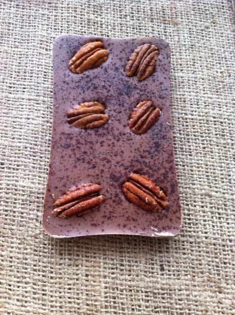 Pecan Nuts, Liquorice and Cinnamon on a caramel milk 34% chocolate bar from Chocolat Chocolates.
