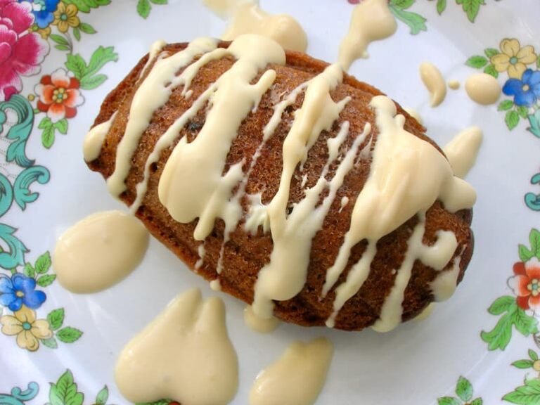 Chilli chocolate madeleine with salted caramel clotted cream sauce drizzled on top.