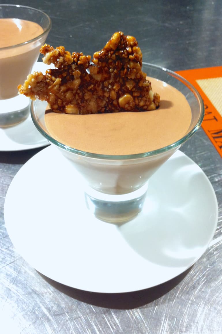 Glass of L'atelier des Chefs chocolate mousse with hazelnut praline.