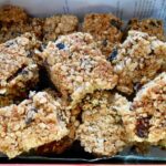 Chocolate mincemeat flapjacks piled up in tin.