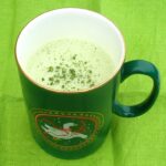 Mug of matcha hot chocolate, made with white chocolate.