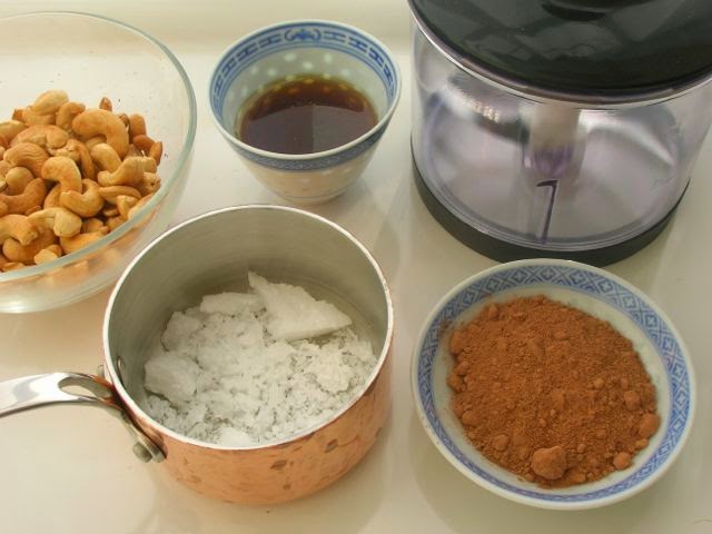 Ingredients to make chocolate cashew nut spread.