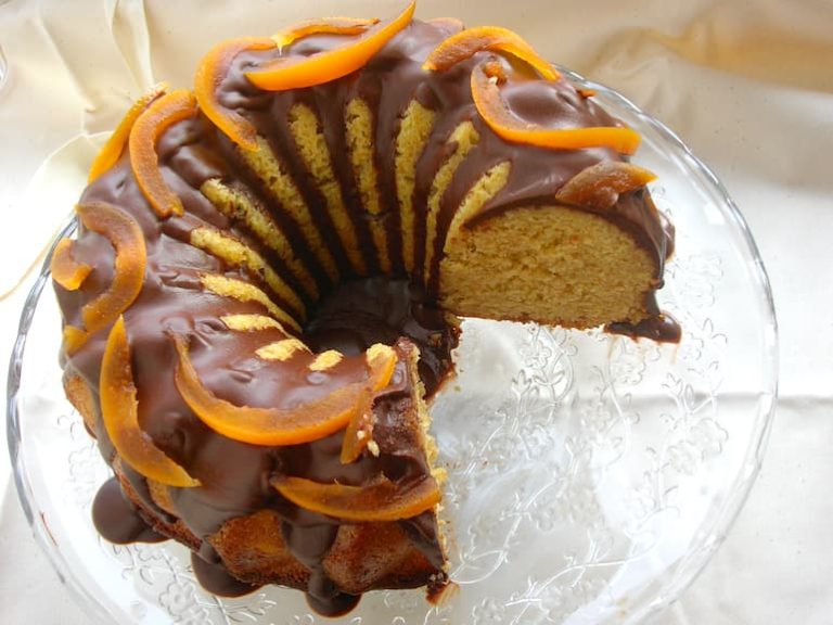 3/4 of a chocolate drizzled grapefruit and honey almond cake.