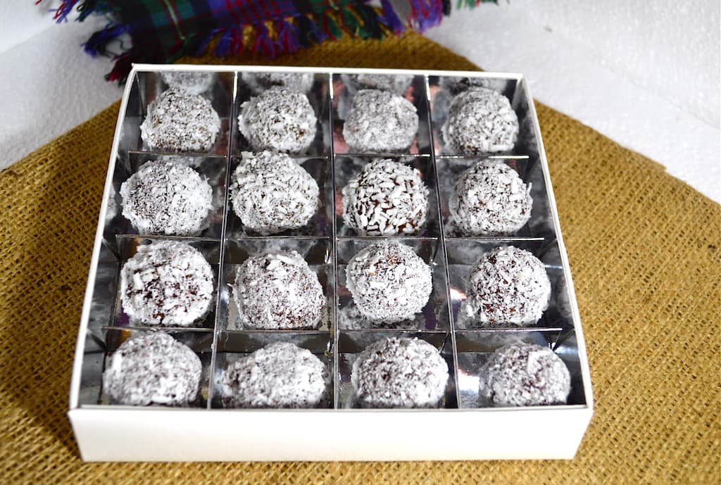 Chocolate box full of coconut bliss balls.