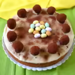 Mincemeat simnel Easter cake with mini eggs and chocolate truffles.