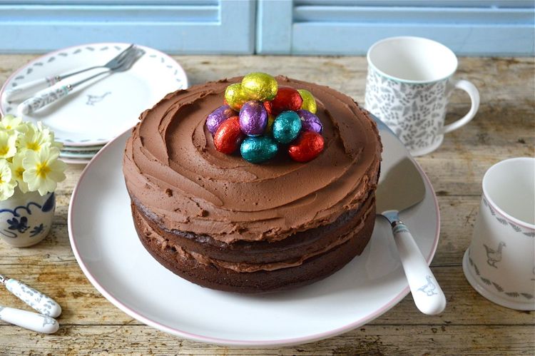 Chocolate Fudge Cake with chocolate cream cheese icing and Easter eggs on top.