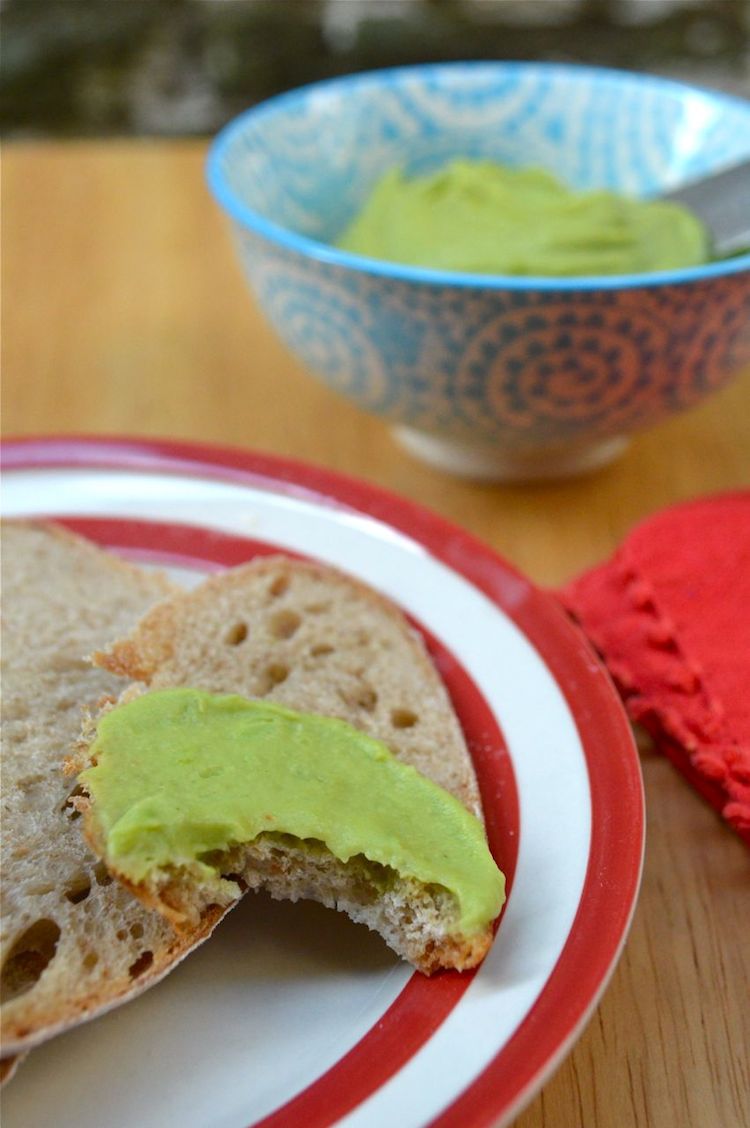Minted Broad Bean Spread on bread with a bowl of it in the background.