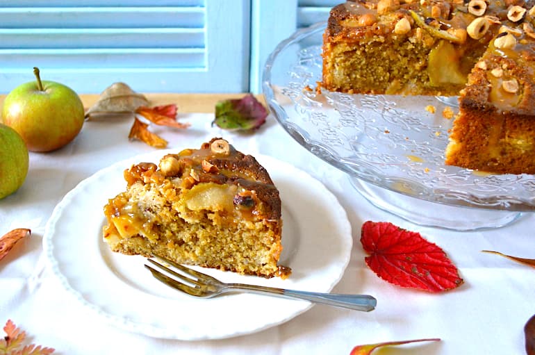 Slice of toffee apple hazelnut cake with smoky salted caramel sauce.